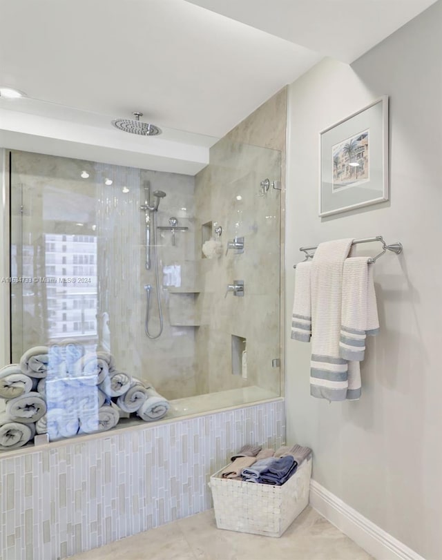 bathroom featuring tiled shower and tile patterned floors