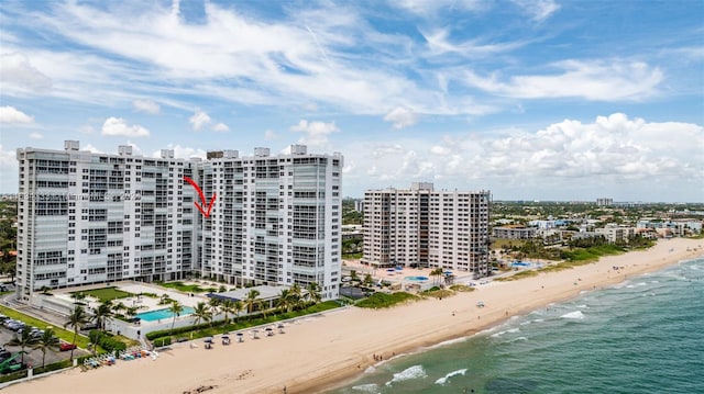 bird's eye view featuring a view of the beach and a water view