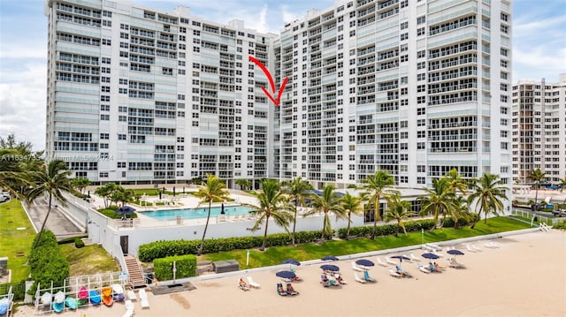 view of building exterior with a community pool