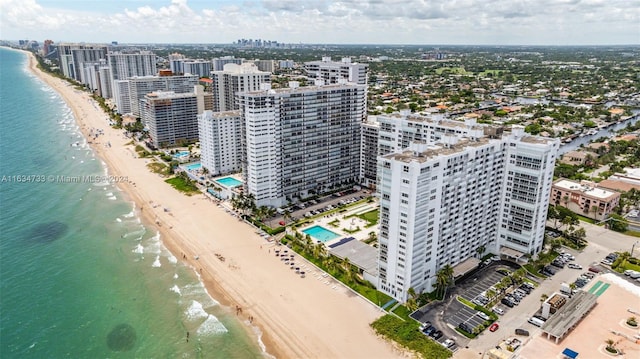 bird's eye view with a view of the beach and a water view