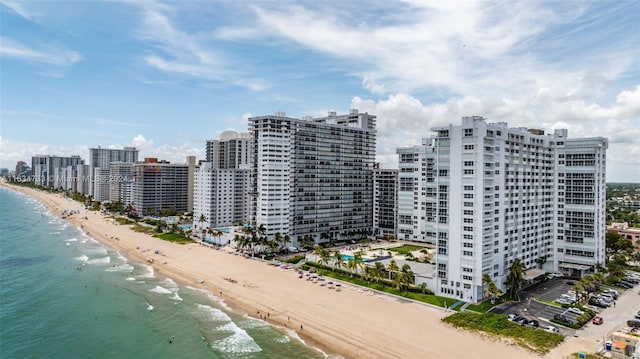 drone / aerial view featuring a view of the beach and a water view