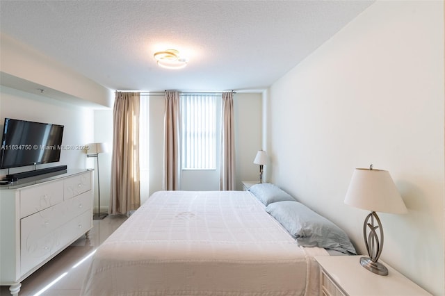 bedroom featuring a textured ceiling