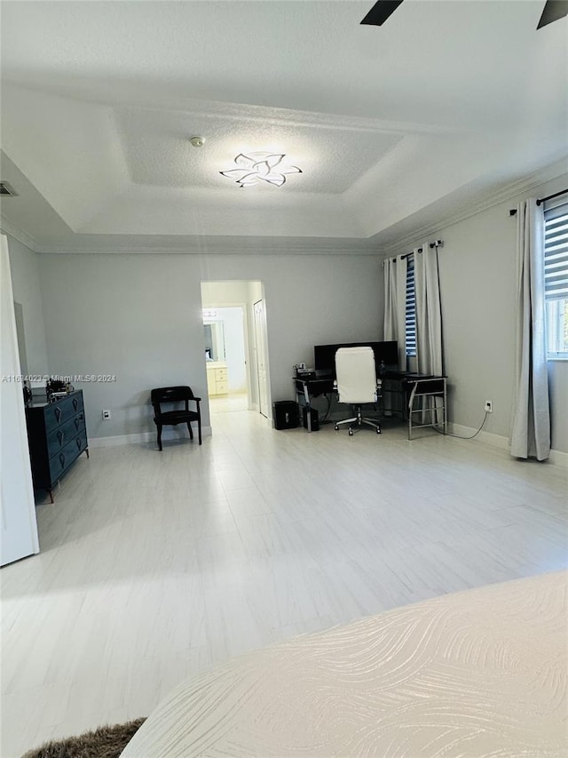 bedroom with a raised ceiling