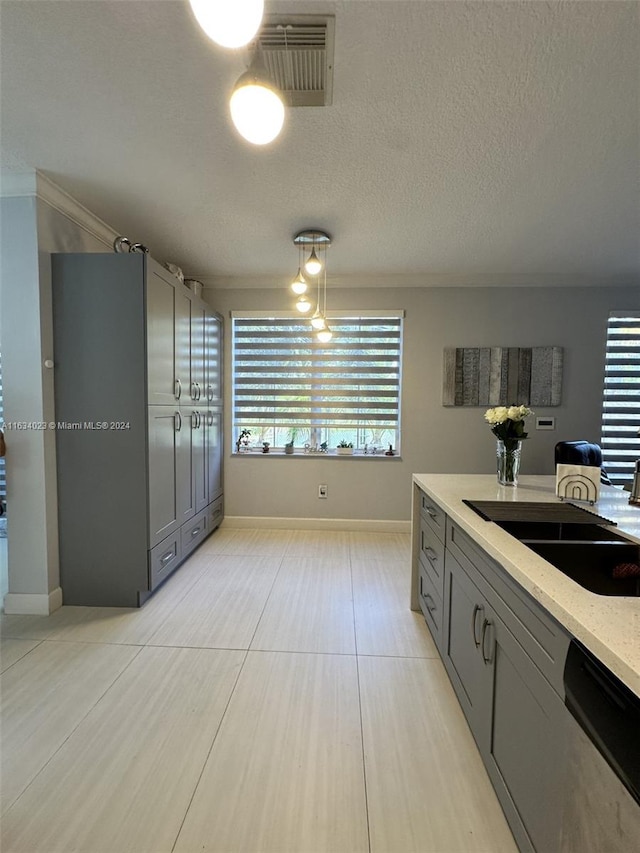 kitchen with gray cabinets, sink, dishwasher, and light tile patterned floors