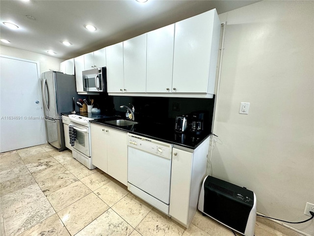 kitchen with sink, stainless steel appliances, and white cabinets