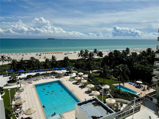 bird's eye view with a view of the beach and a water view