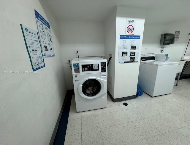 laundry area with washing machine and dryer