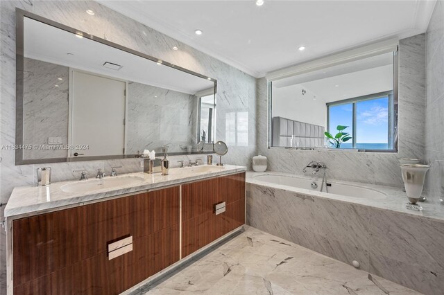 bathroom featuring dual vanity, tile walls, tiled bath, tile patterned floors, and ornamental molding