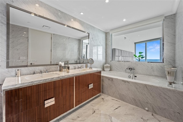 full bath with double vanity, a sink, a garden tub, marble finish floor, and tile walls