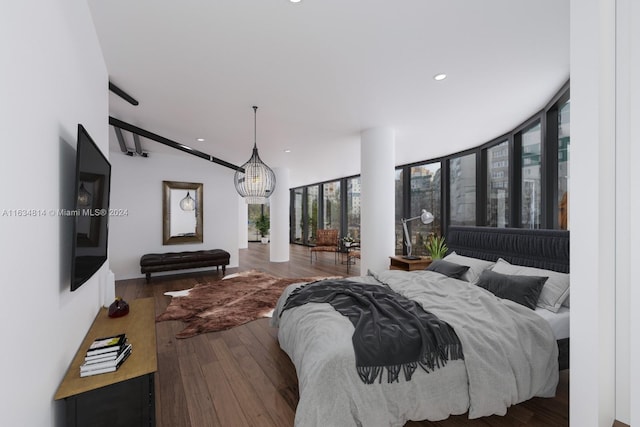 bedroom featuring vaulted ceiling and dark hardwood / wood-style flooring