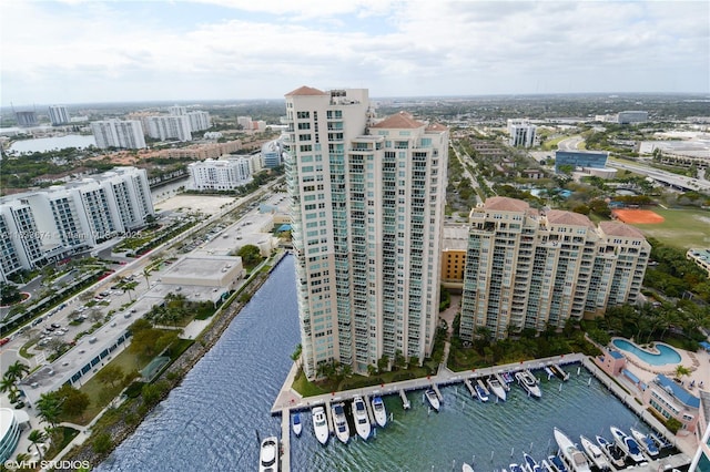 aerial view of property's location with a nearby body of water and nearby urban area