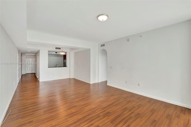 unfurnished living room with hardwood / wood-style flooring