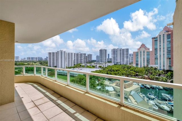 balcony with a view of city and a water view