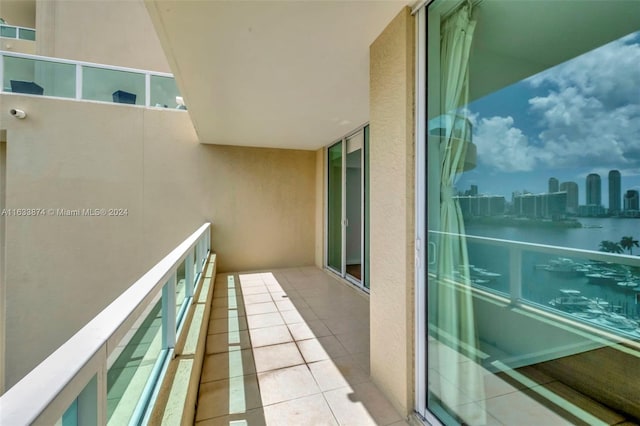 balcony featuring a water view