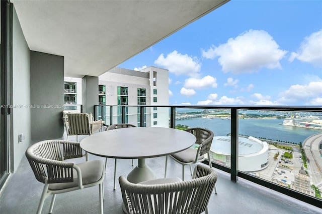 balcony featuring a water view