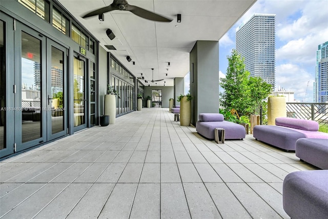 exterior space featuring french doors and ceiling fan