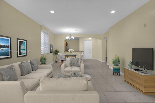 living room featuring a chandelier and light tile patterned floors