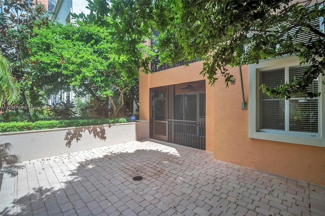 view of patio / terrace featuring a sunroom