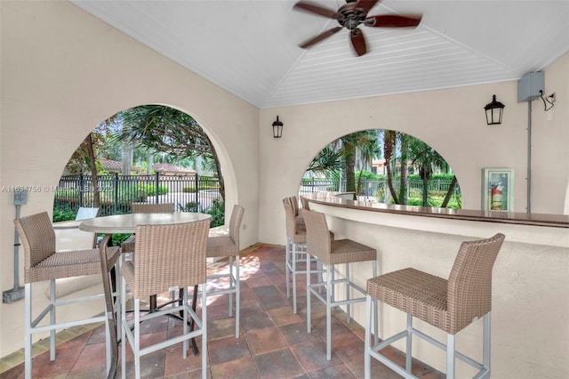 view of patio / terrace with ceiling fan and exterior bar