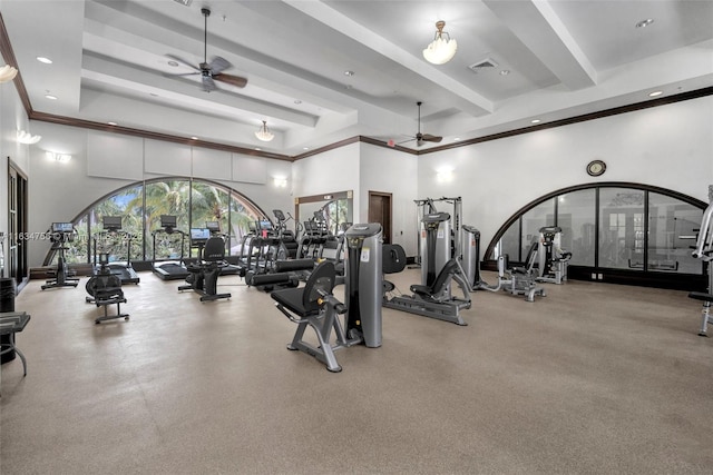 gym featuring ceiling fan and a towering ceiling