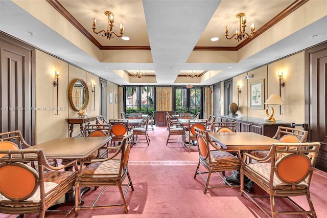 dining room with carpet, a tray ceiling, a chandelier, and crown molding