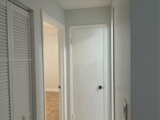 hall featuring tile patterned floors