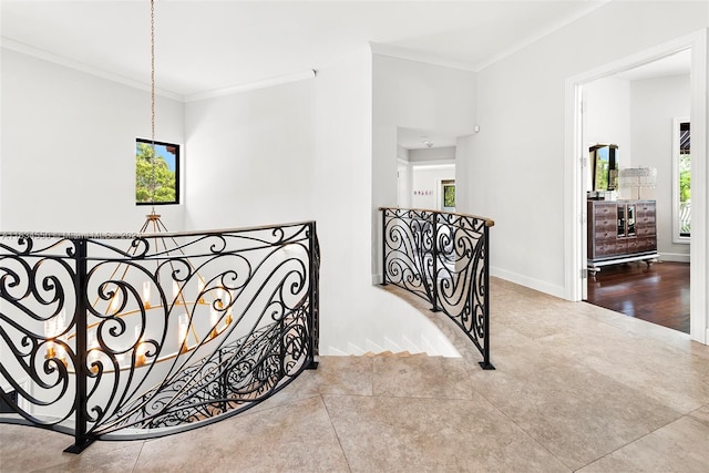 stairs featuring tile patterned floors, a healthy amount of sunlight, and crown molding