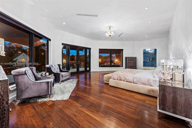 bedroom featuring access to outside and hardwood / wood-style flooring