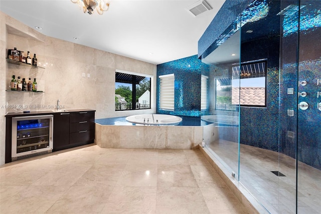 bathroom featuring plus walk in shower, tile walls, wine cooler, and vanity