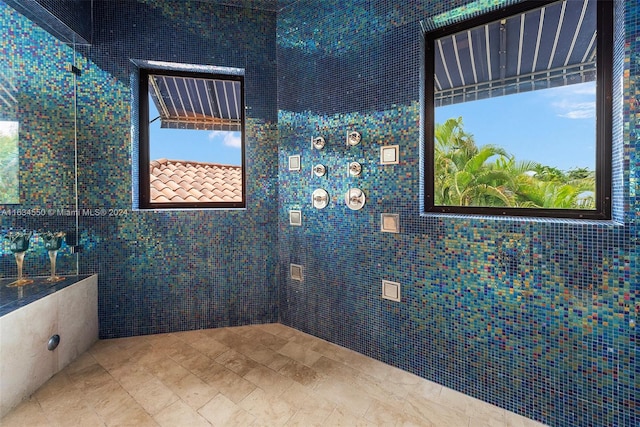 bathroom with tile walls