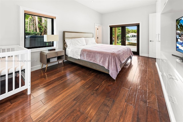 bedroom with wood-type flooring and french doors