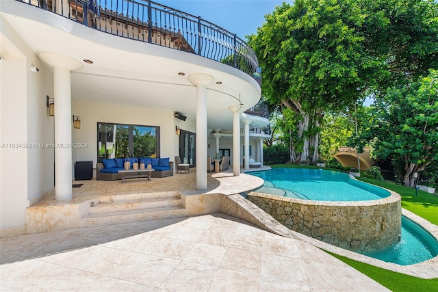 view of swimming pool with outdoor lounge area and a patio area