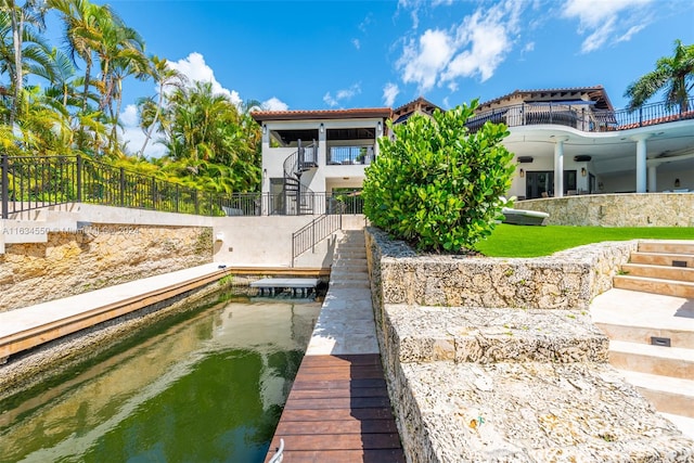 rear view of house with a water view