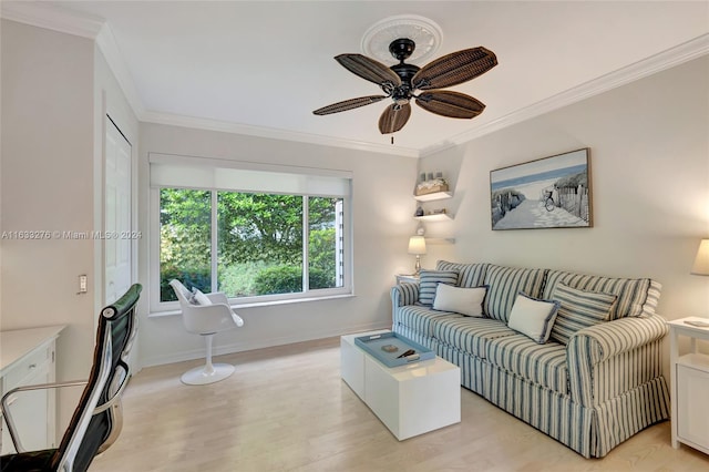 living room with crown molding, light hardwood / wood-style flooring, and ceiling fan