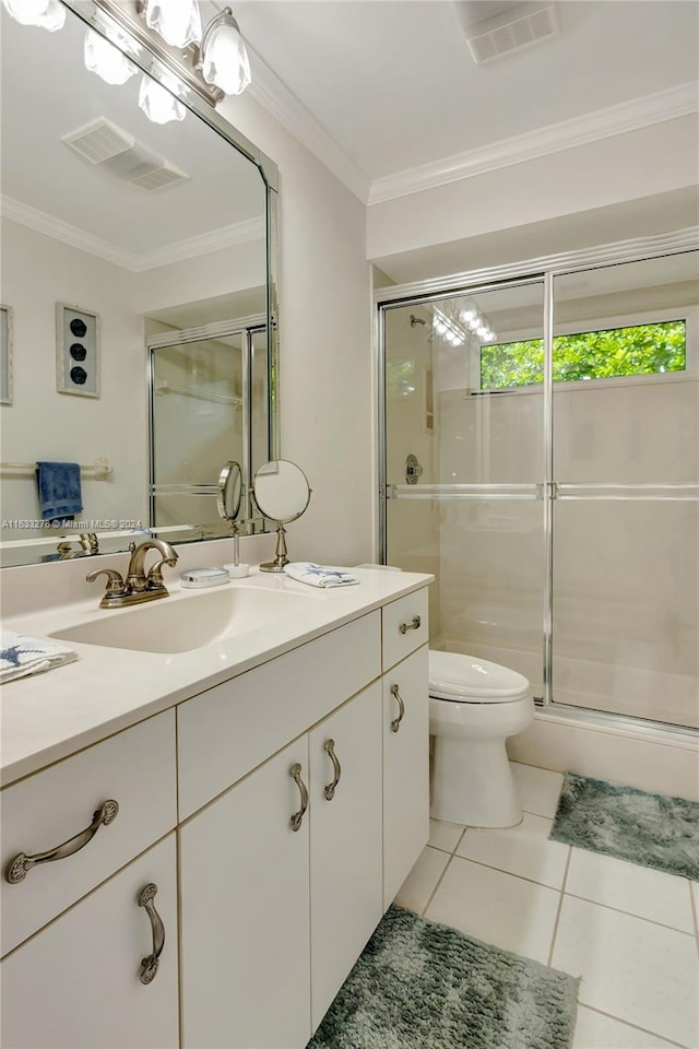 bathroom with vanity, tile patterned flooring, toilet, and crown molding