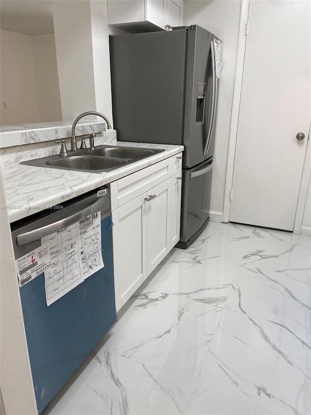 kitchen featuring dishwashing machine, white cabinetry, light tile patterned flooring, stainless steel refrigerator with ice dispenser, and sink