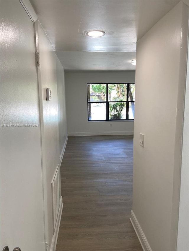 hallway featuring dark wood-type flooring