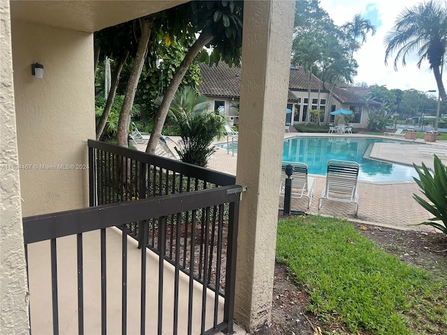 view of swimming pool featuring a patio area