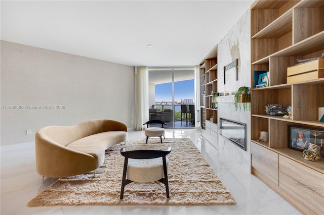 17111 Biscayne Blvd Unit 304, North Miami Beach, FL 33160 - living area featuring a wall of windows