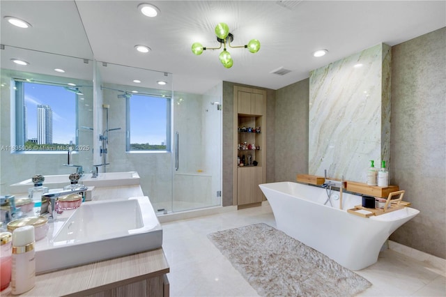 17111 Biscayne Blvd Unit 304, North Miami Beach, FL 33160 - bathroom featuring vanity, a shower stall, a freestanding tub, and recessed lighting