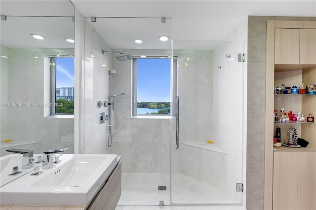 17111 Biscayne Blvd Unit 304, North Miami Beach, FL 33160 - bathroom with a shower stall, vanity, healthy amount of natural light, and recessed lighting