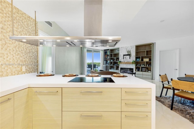 17111 Biscayne Blvd Unit 304, North Miami Beach, FL 33160 - kitchen with black electric cooktop, extractor fan, modern cabinets, and light countertops