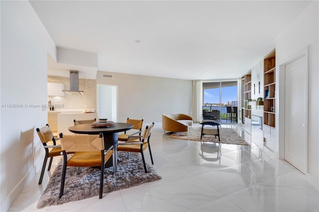 dining room featuring floor to ceiling windows