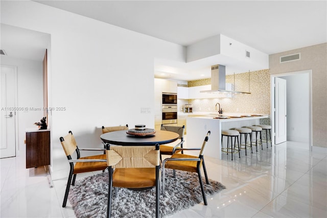 dining room featuring sink