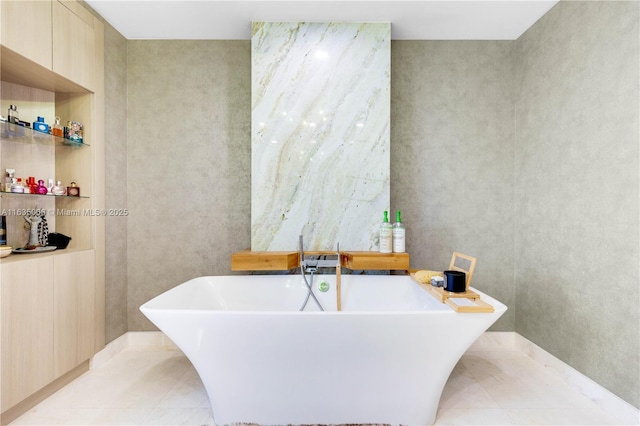 bathroom with tile patterned flooring and a bathing tub