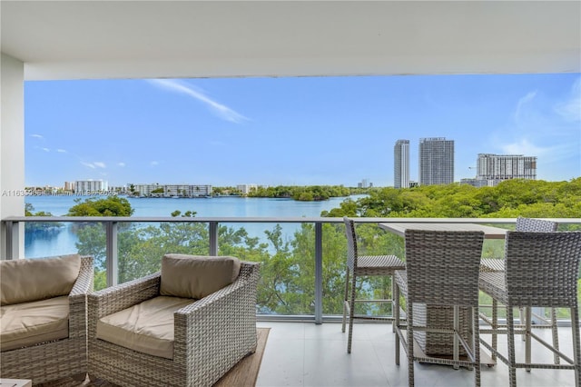 balcony featuring a water view