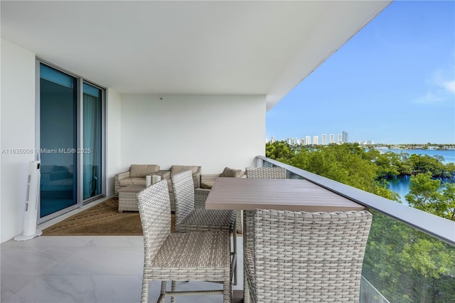 balcony featuring a water view