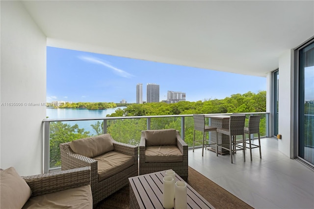 balcony featuring a water view