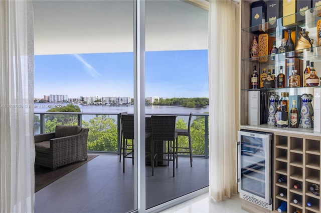 interior space with a water view and beverage cooler