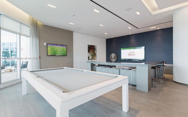 game room featuring a wealth of natural light, pool table, and light hardwood / wood-style flooring